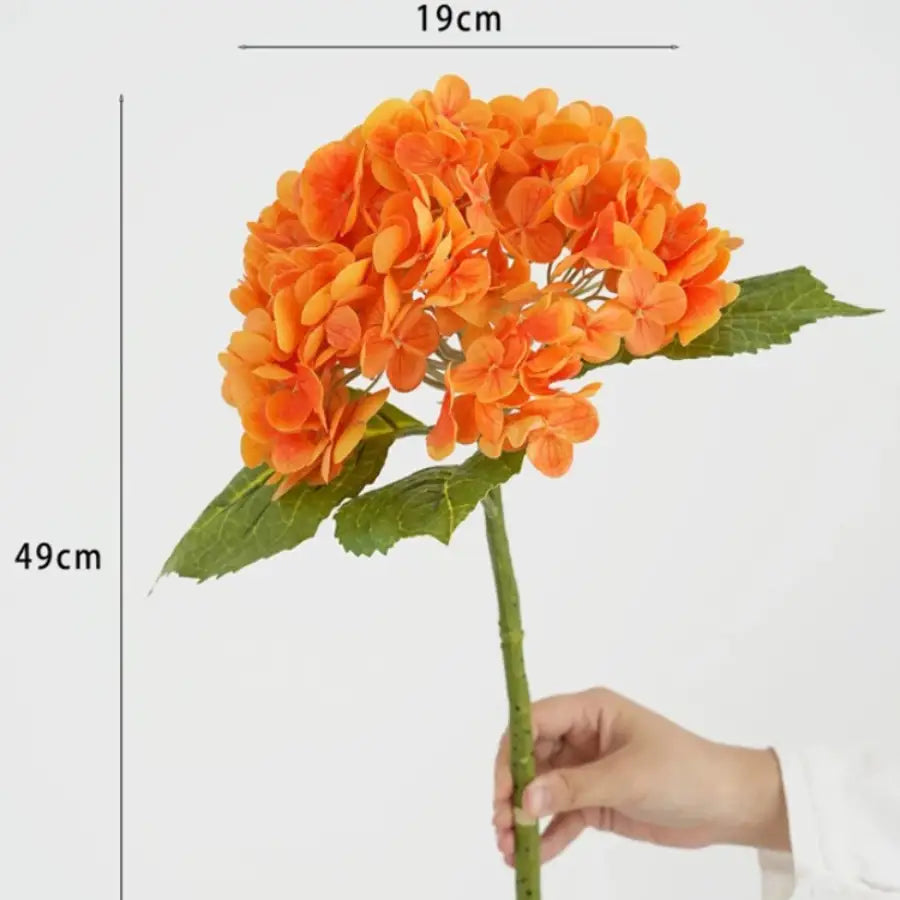 Hydrangea artificielle orange Hortensia vibrante avec feuilles vertes